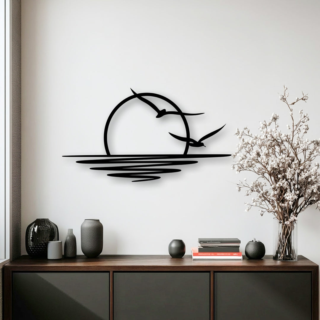 Graceful seagulls soar above the stylized ocean waves during a vibrant sunset, captured in striking metal wall decor.