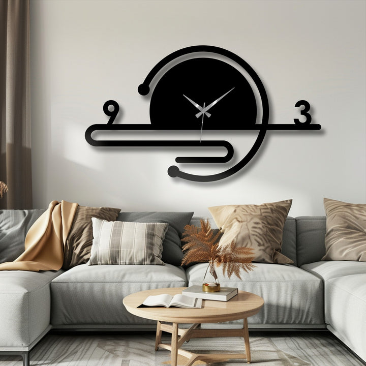 Featuring a minimalist black decorative metal art clock displaying a modern geometric orbit line design adding a striking touch to any interior.