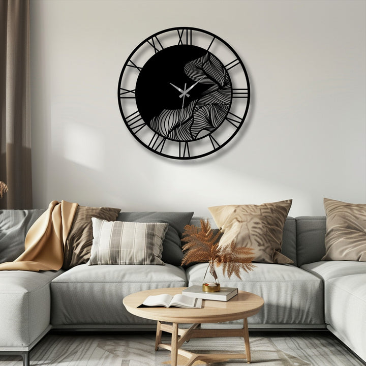 Smooth, matte surface texture defines this metal wall clock, an abstract leaf design with Roman numerals, presenting a modern decorative metal art piece.