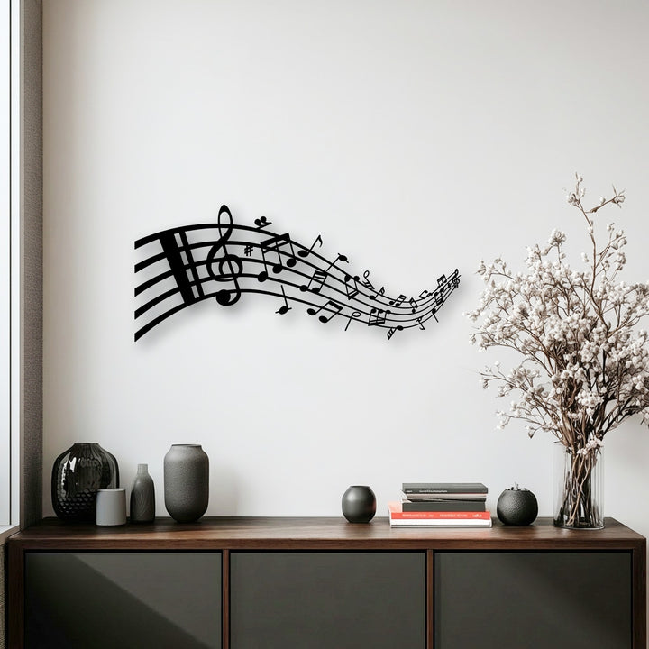 Minimalist color saturation highlights the crisp detail of the black flowing musical notes metal artwork with a treble clef.