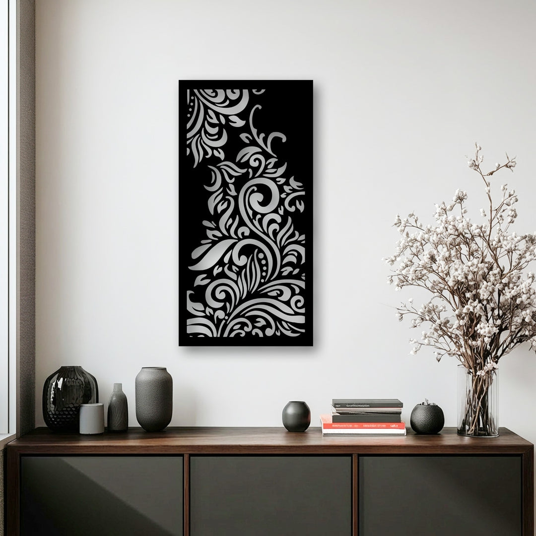 Dark textured vases, a decorative sphere, and stacked books on a wooden console highlight the stylish foreground, complementing the ornamental metal artwork.