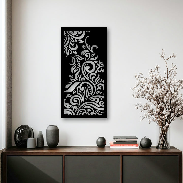 Dark textured vases, a decorative sphere, and stacked books on a wooden console highlight the stylish foreground, complementing the ornamental metal artwork.
