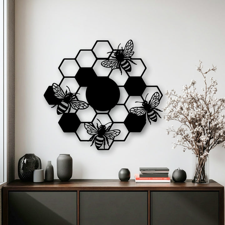 The stark color contrast highlights the black honeycomb bees metal wall art against the bright white wall, a striking piece of decoration wall art.