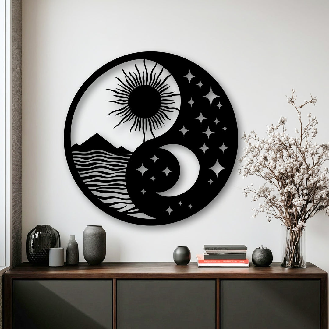 The darkest area of this metal art for wall features a yin yang design showing mountains, waves, glittering stars, and a crescent moon.