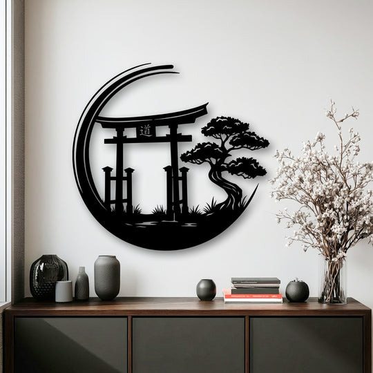 A neutral color temperature highlights the striking black Zen Garden Torii Gate metal art for wall, contrasted by warm wood and delicate white flowers.