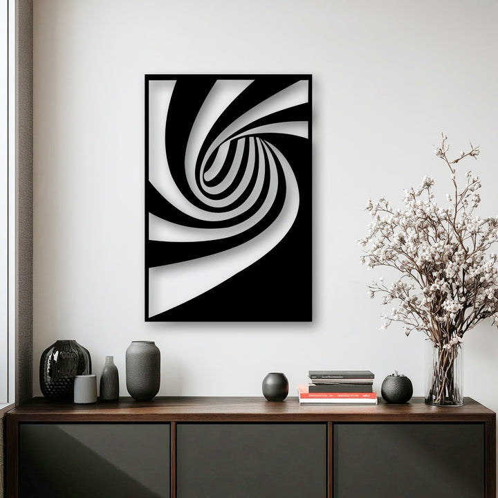 Geometric elements create a dynamic black and white spiral flow, forming an intriguing optical illusion in this contemporary metal wall decor.
