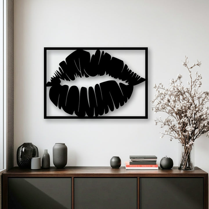 Gentle white blossoms gracefully soften the striking bold kiss silhouette metal wall decor, a modern lips art piece.