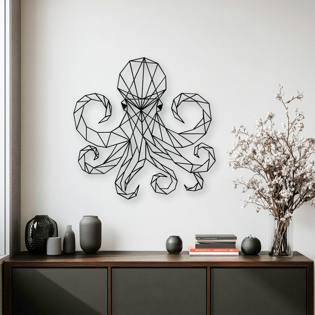The low color saturation of this geometric octopus metal wall decor highlights its stark black lines against the muted white wall.
