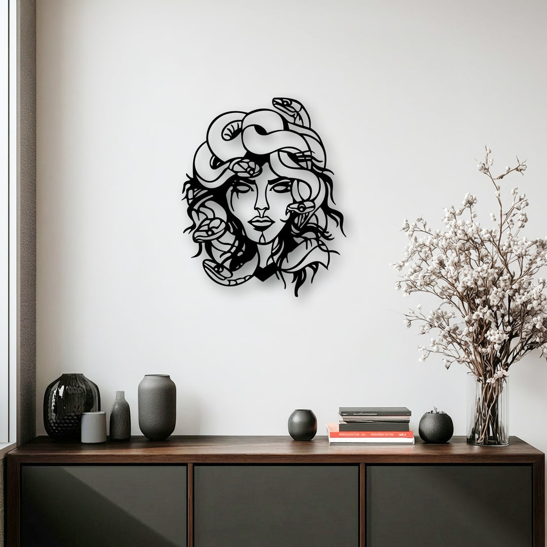 The realistic detail of the Medusa metal artwork showcases intricate snakes coiling around her face, bringing mythological decor to life.