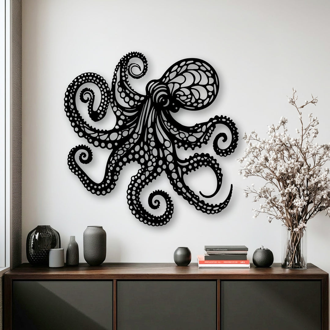The dimensional black octopus metal wall decor adds stunning depth and layers to a bright white wall, creating a captivating nautical ocean display.