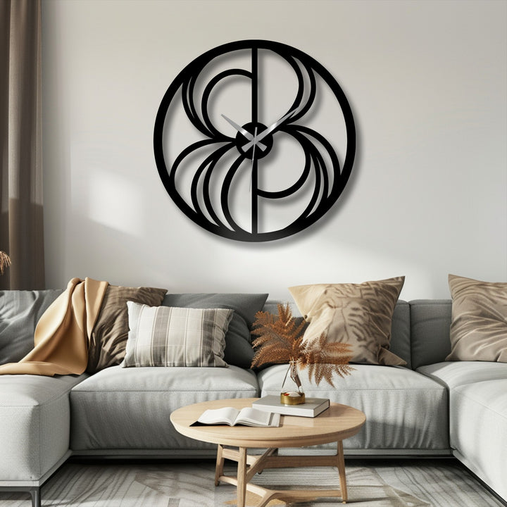 Featuring a sleek, matte black finish, this abstract swirl metal decoration wall art doubles as a modern geometric clock.