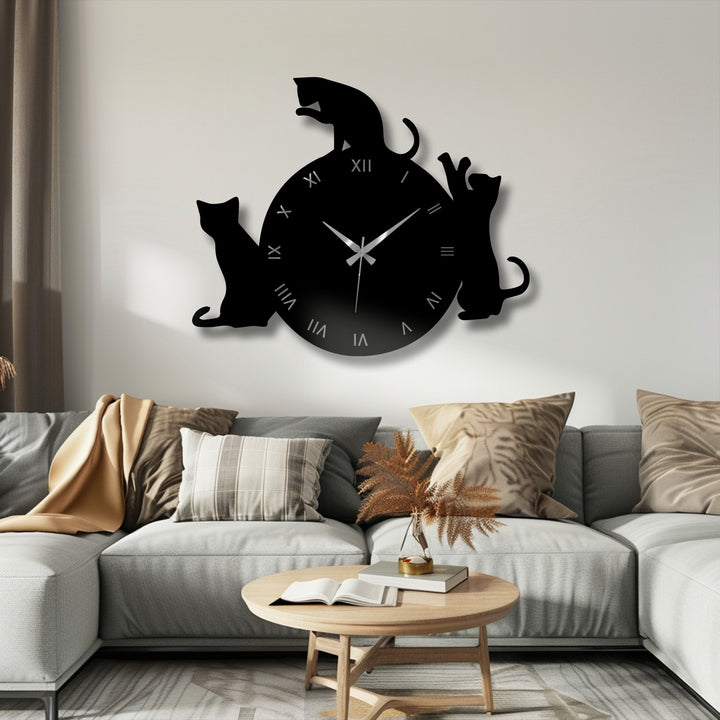 Focusing on the black metal cats and Roman numerals, this clock represents a modern piece of metal art for wall clocks, ideal for pet lovers.