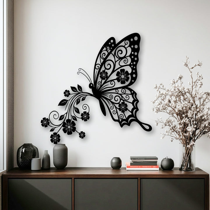 Predominantly black and white, this image features an intricate butterfly floral design decorative metal art against a crisp white background.