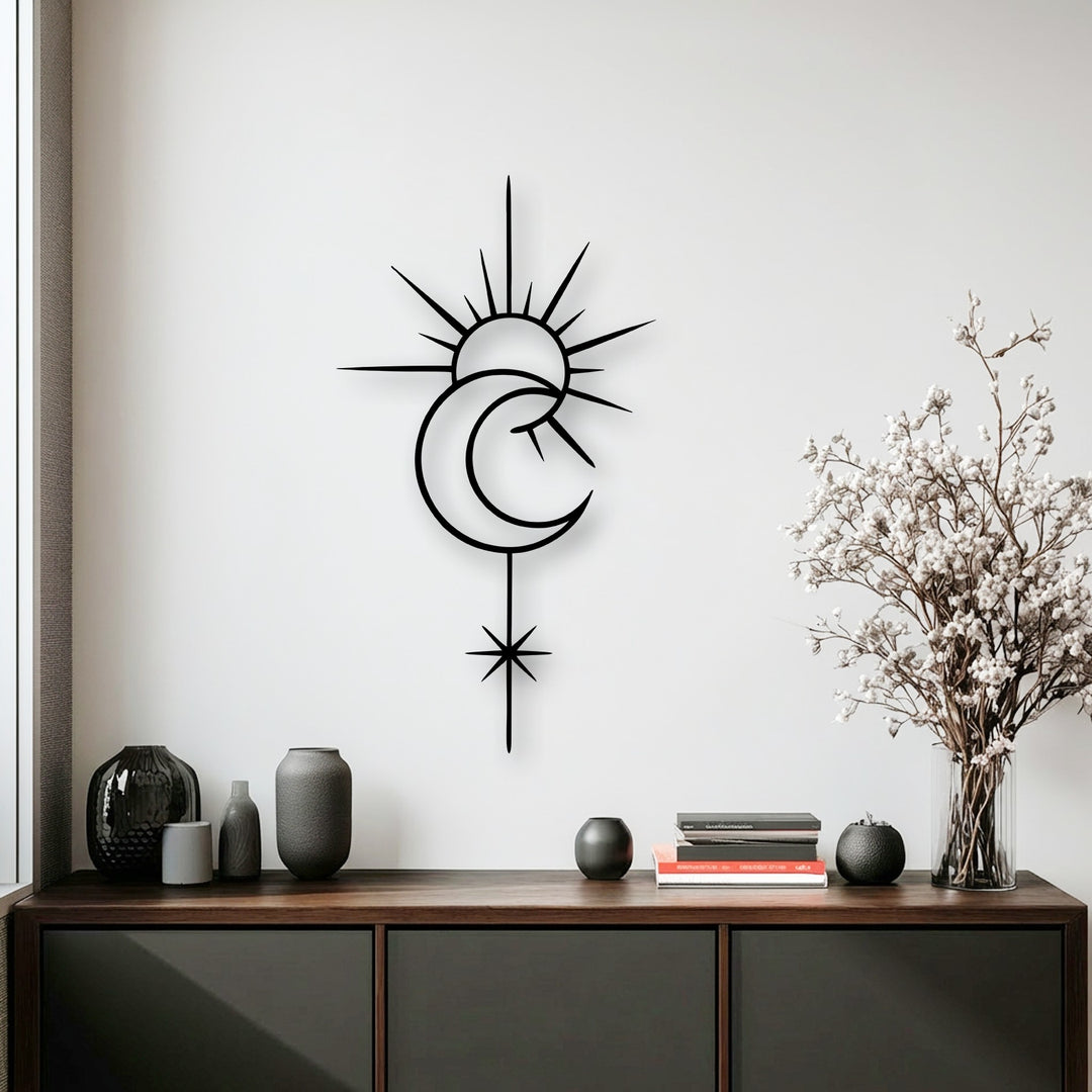 Soft shadows accentuate the sleek lines of the celestial sun moon metal wall decor, creating depth against the bright wall.