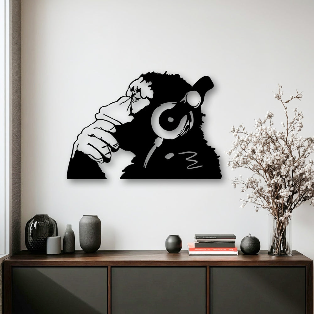 The black Urban Monkey Headphones metal decoration wall art displays a sleek, slightly reflective surface texture, creating a smooth visual presence.