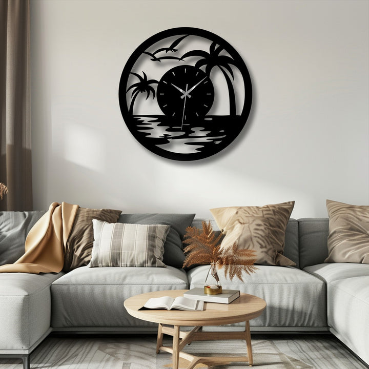 Dramatic light transitions define the metal wall clock's beach scene, creating decorative metal art with palm trees silhouetted against a radiant sunset.