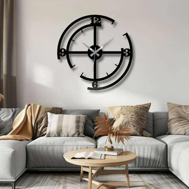The sleek black finish of this minimalist metal wall decor accentuates the modern geometric design of the wall clock.
