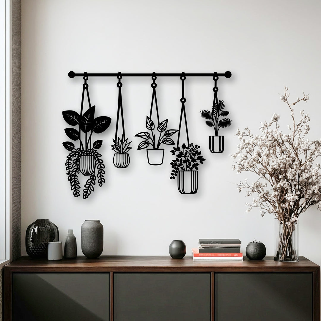 The premium metal wall decor showcases an intricate botanical design of hanging plants, crafted with exceptional durability.