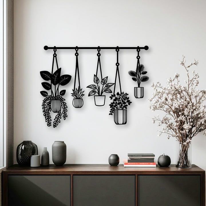 The premium metal wall decor showcases an intricate botanical design of hanging plants, crafted with exceptional durability.