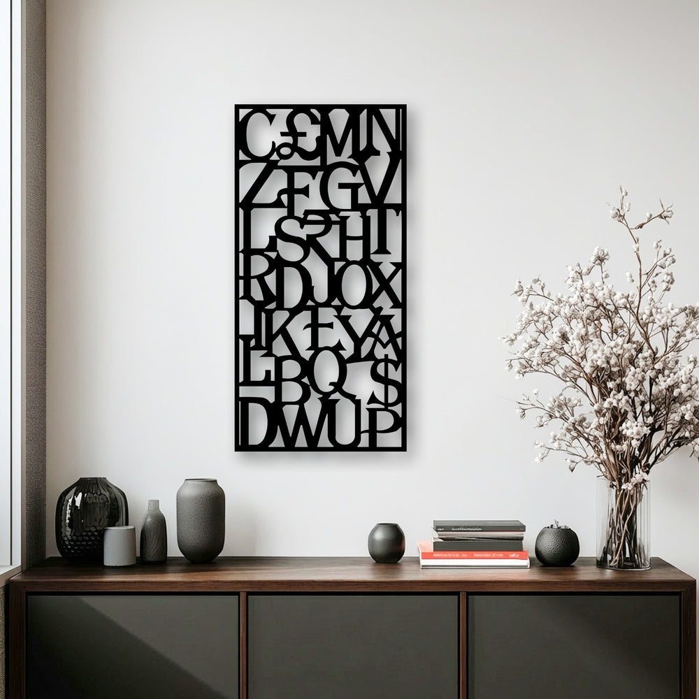 The intricate, interlocking letters of this unique metal wall art create a captivating visual flow, as if the abstract alphabet is in constant motion.