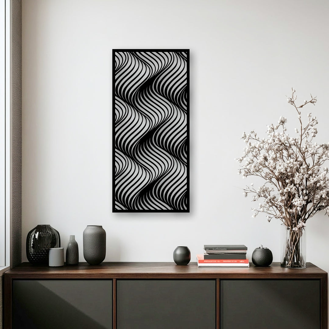 A monochromatic metal artwork features an undulating, flowing wave pattern, its highly desaturated tones creating a striking abstract modern line design.