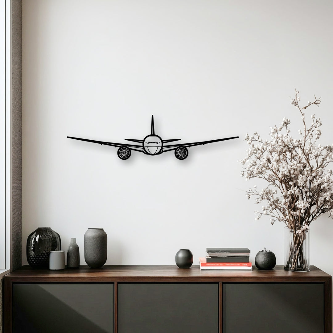 A sleek black airplane silhouette appears to soar forward on a white wall, a dynamic piece of aviation metal art for wall.
