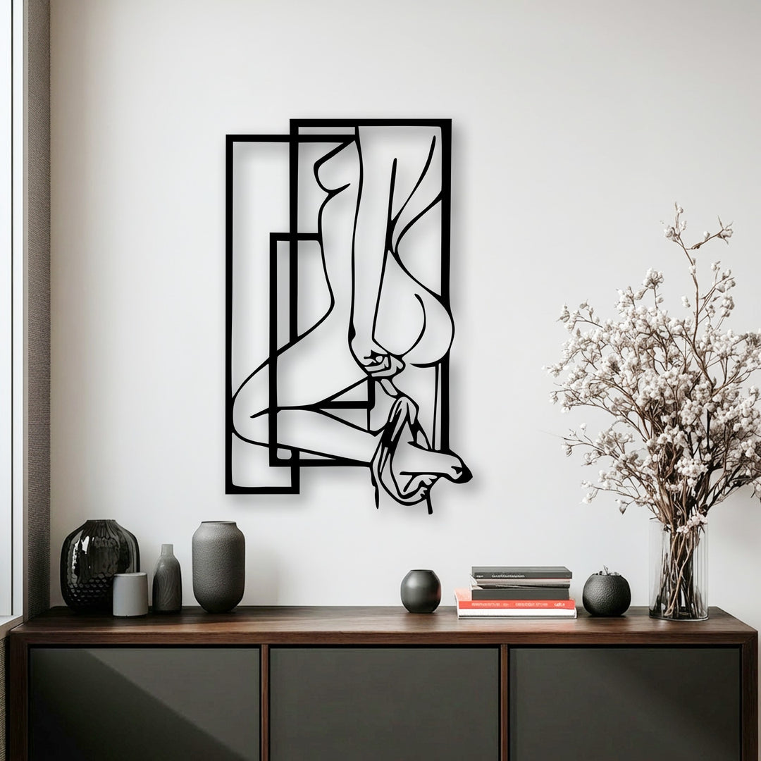 Against the luminous white wall, an abstract feminine silhouette metal artwork with bold geometric frames creates a modern statement.