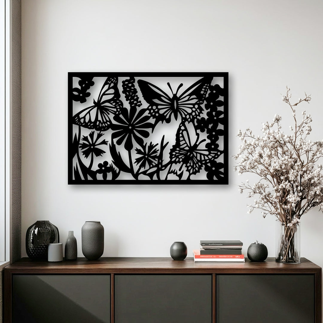 A bright, plain white wall serves as the minimalist background for the striking Butterfly Garden decorative metal art, enhancing its floral nature silhouette.