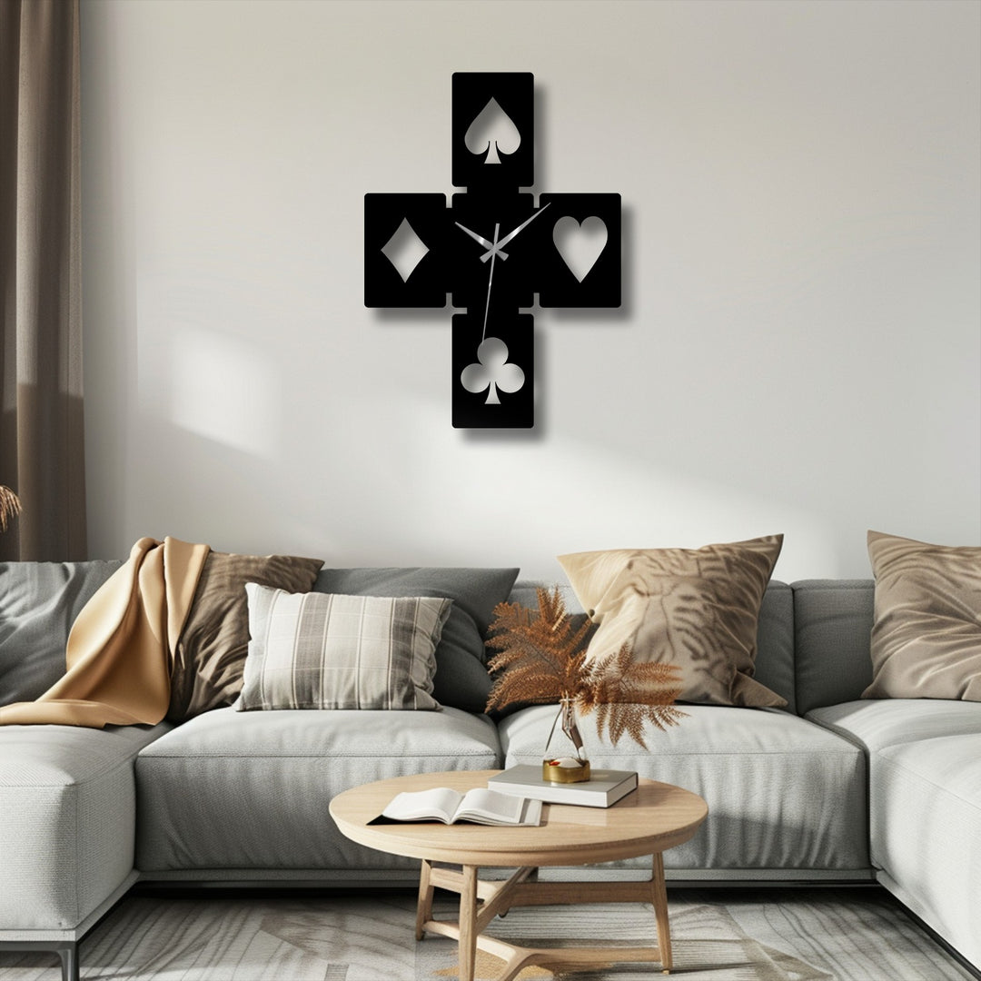 Evoking the smooth, continuous passage of time, this unique metal wall art playing card symbols clock features precisely moving hands.