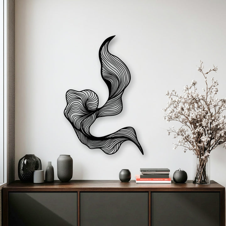 The darkest area reveals a unique metal wall art piece with an intricate abstract fluid line design on a bright white background.
