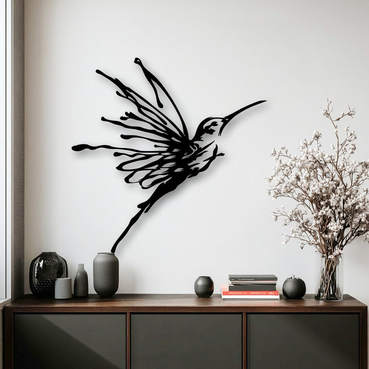 The darkest area reveals an abstract, matte black flying hummingbird metal art for wall, showcasing its elegant nature bird design with dynamic flowing lines.