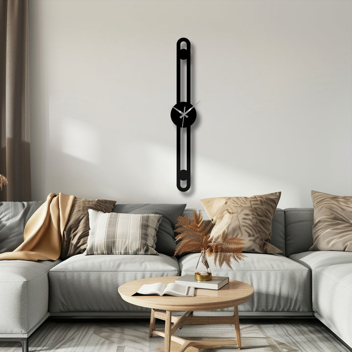 Highlighting the abstract quality, the minimalist vertical metal wall clock presents as striking metal art for wall, its slim line decor embodying a modern and unconventional timepiece design.