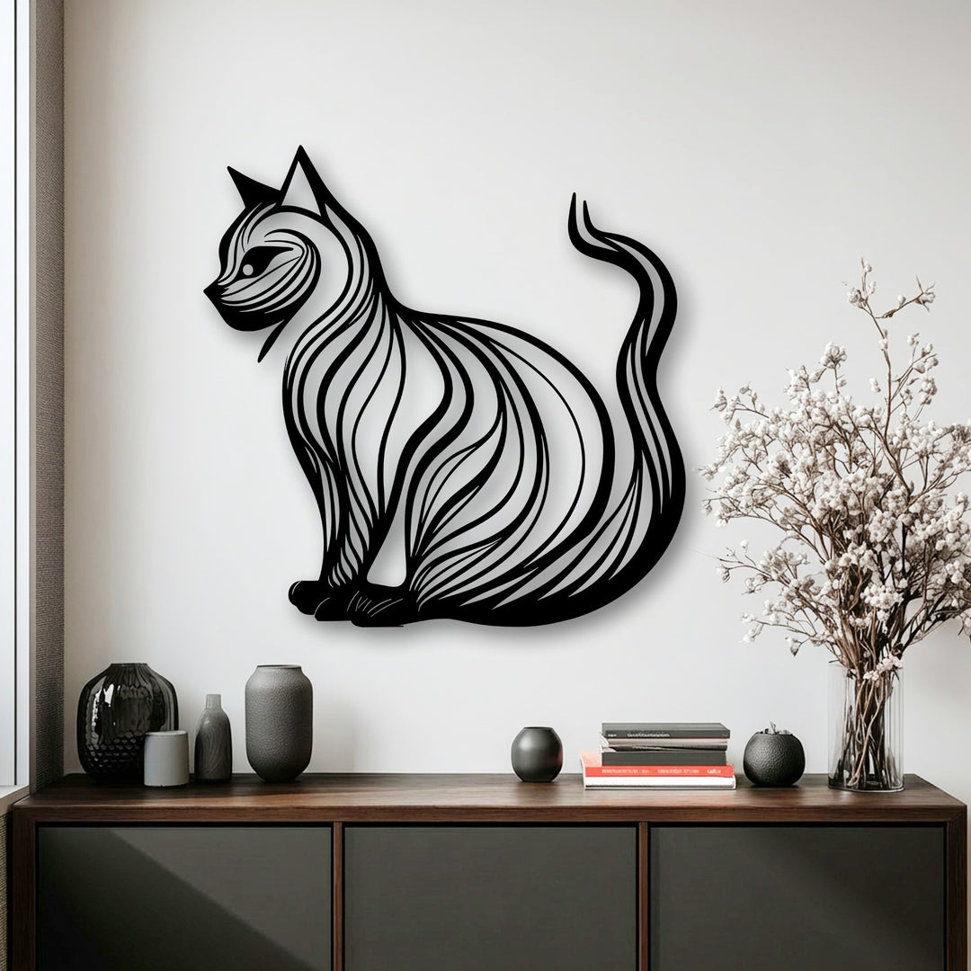 This elegant metal artwork showcases a distinctively shaped, seated cat silhouette, oriented to the left with dynamic internal line patterns.