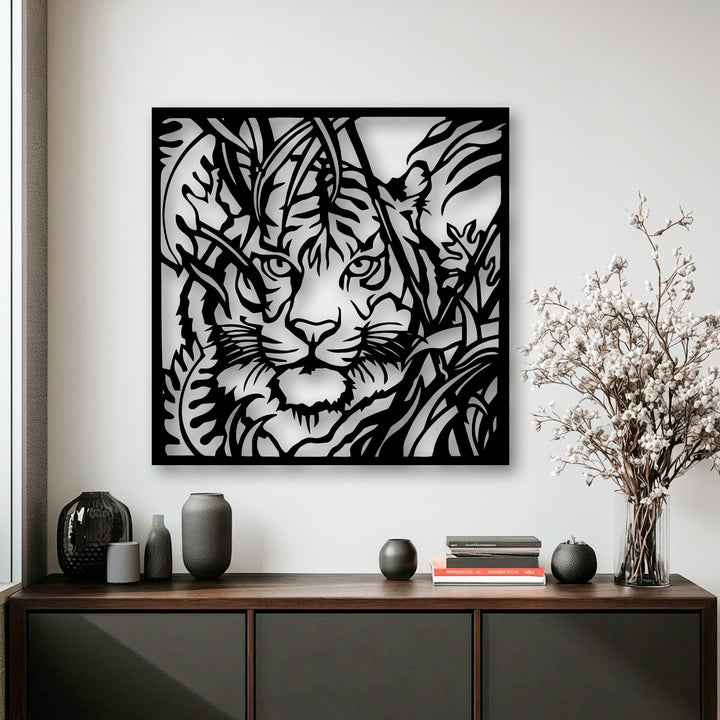 An intense tiger's gaze from stylized jungle foliage is the focal point of this unique metal wall art.