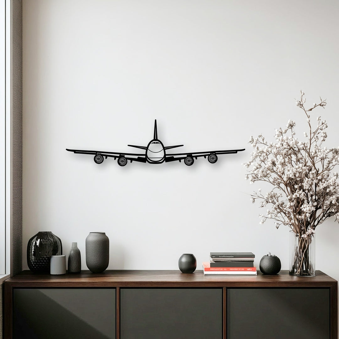A clean, minimalist off-white wall serves as the perfect backdrop for an intricate airplane front view metal wall decor, highlighting its aviation appeal.