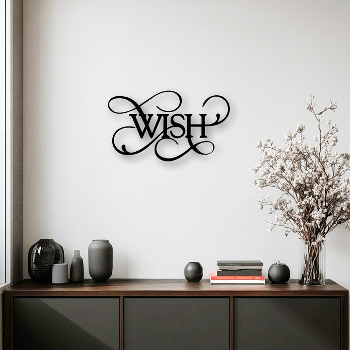 The layering effect of the elegant script 'Wish' metal art for wall creates captivating depth against the white background.