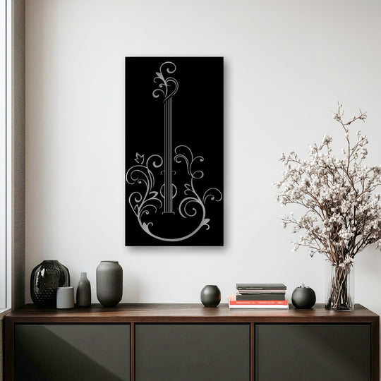 The brightest area, a pristine white wall, beautifully displays elegant guitar silhouette metal artwork with a musical floral design.