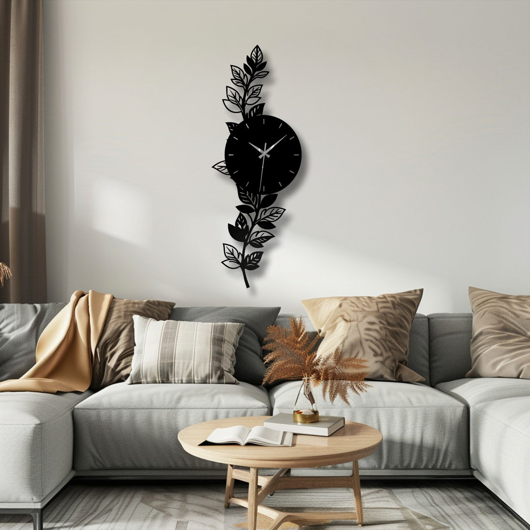 Showing the layering effect, the botanical leaf decorative metal art clock features a stylish design where leaves surround the circular time piece.