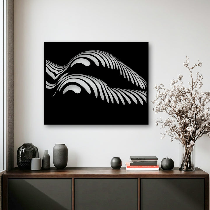An arrangement of dark gray vases and books rests on a wooden credenza in the foreground, complementing the abstract wave metal wall decor hanging above.