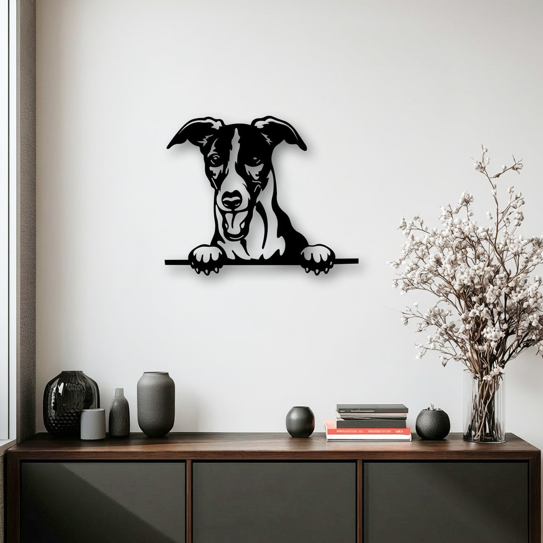 The matte black finish of this unique metal wall art showcases a curious puppy peeking silhouette decor.