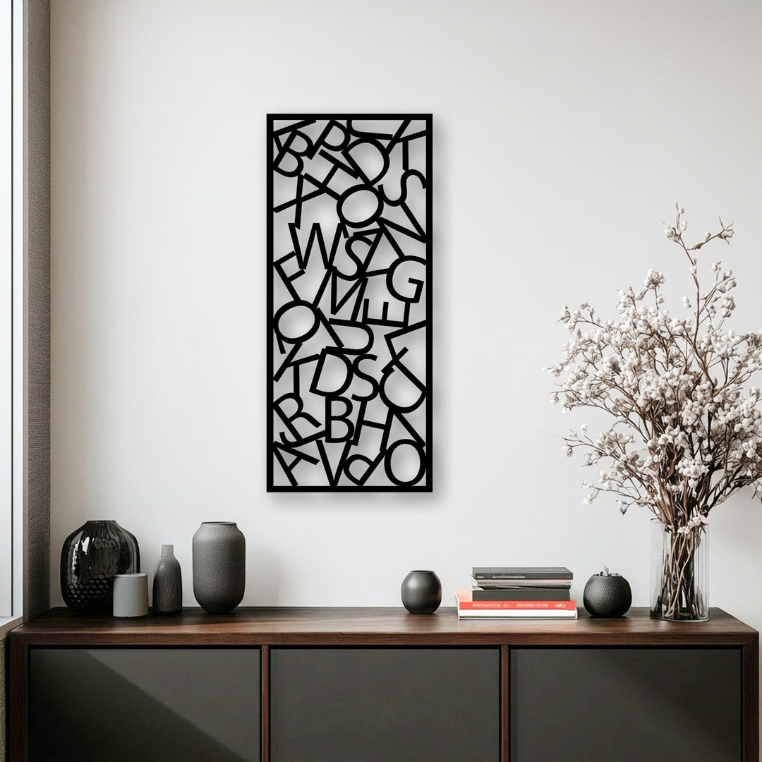The cool and contemporary color temperature highlights the striking abstract typography decorative metal art above a dark wooden cabinet.