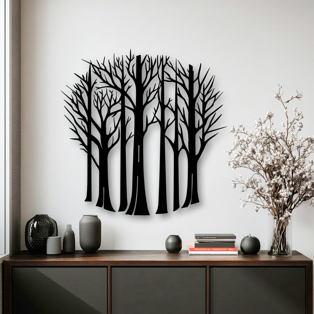 A striking silhouette of bare forest trees crafted as metal wall art creates a captivating decoration wall art piece.