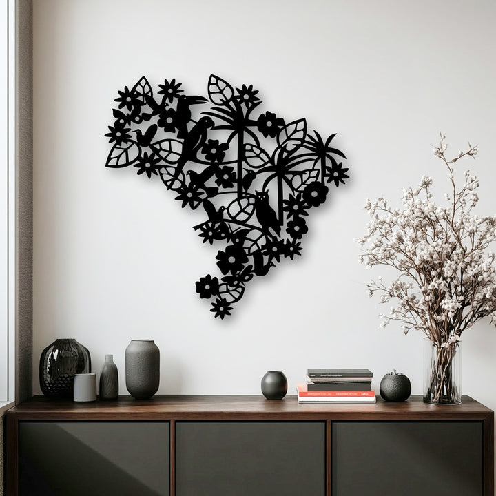 A dark cabinet in the foreground holds elegant vases and white flowers, beautifully complementing the detailed floral bird decorative metal art.