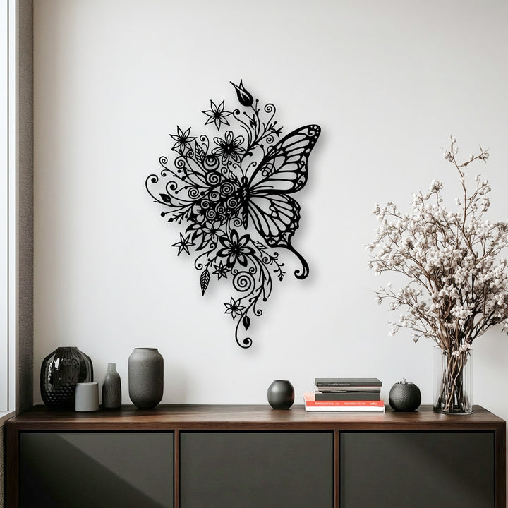 The organic forms of the elegant floral butterfly decorative metal art piece are gracefully displayed on a crisp white wall, offering nature-inspired decor.