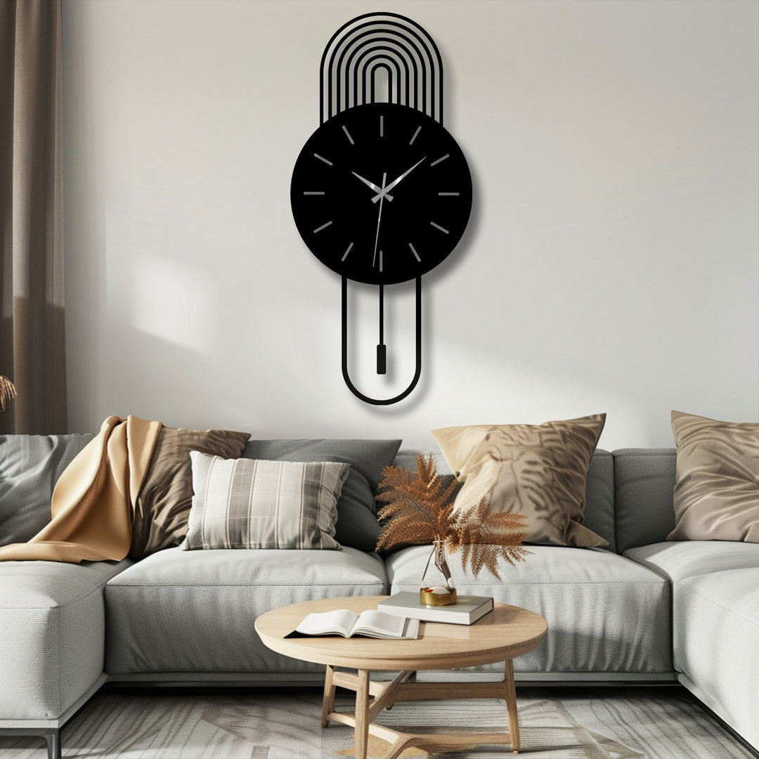 Showing depth and layers, this decorative metal art wall clock features a pendulum design, with arc detailing that adds a modern touch.