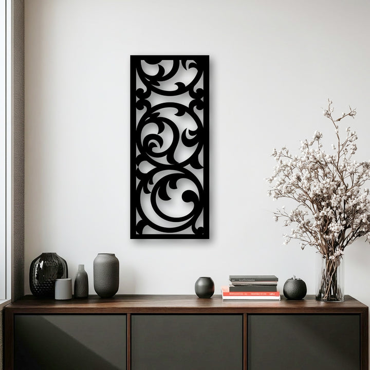 The crisp, dark edges and defined borders of the ornate floral scroll metal wall decor panel create a striking contrast.