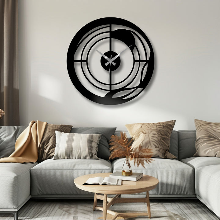 Organic forms intertwine within this unique metal wall art clock, spiraling around the minimalist, geometric design.