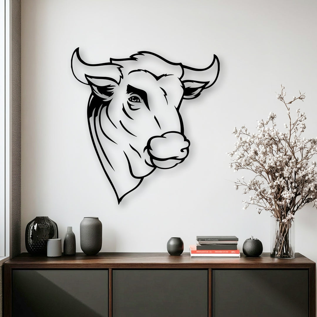 The abstract quality of this minimal line bull head metal wall decor offers a striking contrast against the bright white wall, featuring elegant rustic animal art.