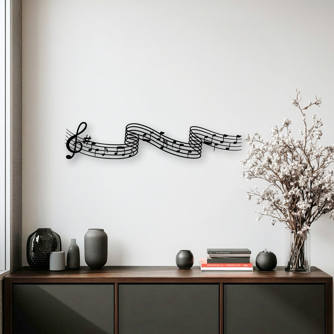 The negative space around the elegant black flowing melody notes metal wall decor creates a striking contrast on the white wall.
