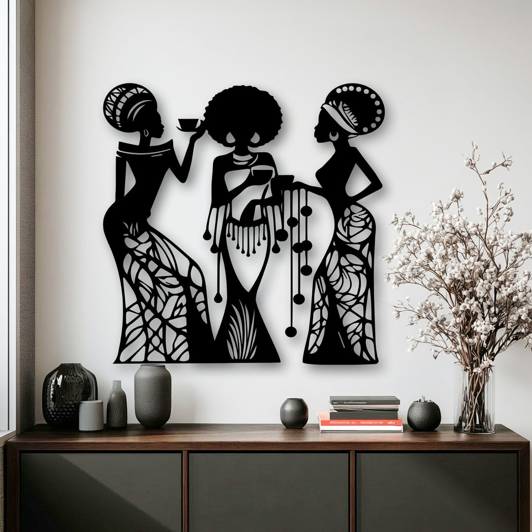 The visual rhythm of three stylized metal wall art silhouettes of women in flowing patterns creates an intricate decoration wall art display.